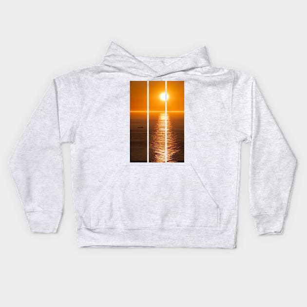 Wonderful landscapes in Norway. Nord-Norge. Beautiful scenery of a midnight sun sunset at Nordkapp (Cape North). Boat and globe on a cliff. Rippled sea and clear orange sky. (vertical) Kids Hoodie by fabbroni-art